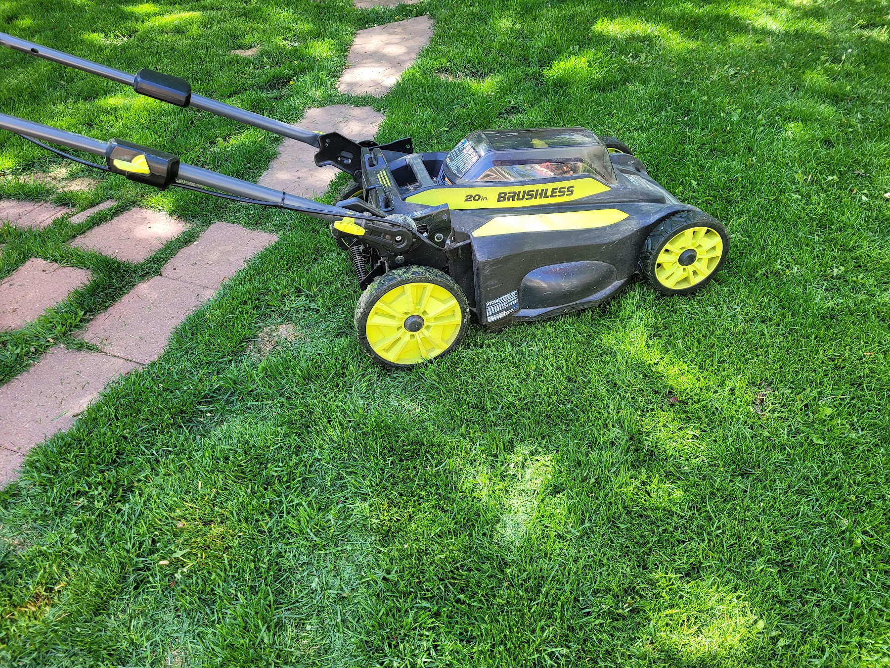 A mower back on freshly cut grass after service